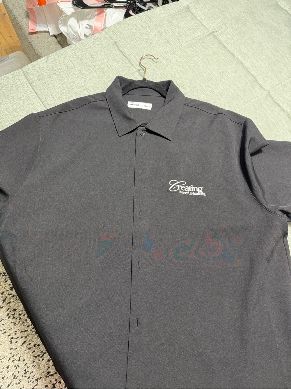 Bershka “Creating Mindful Realities” black button-up shirt